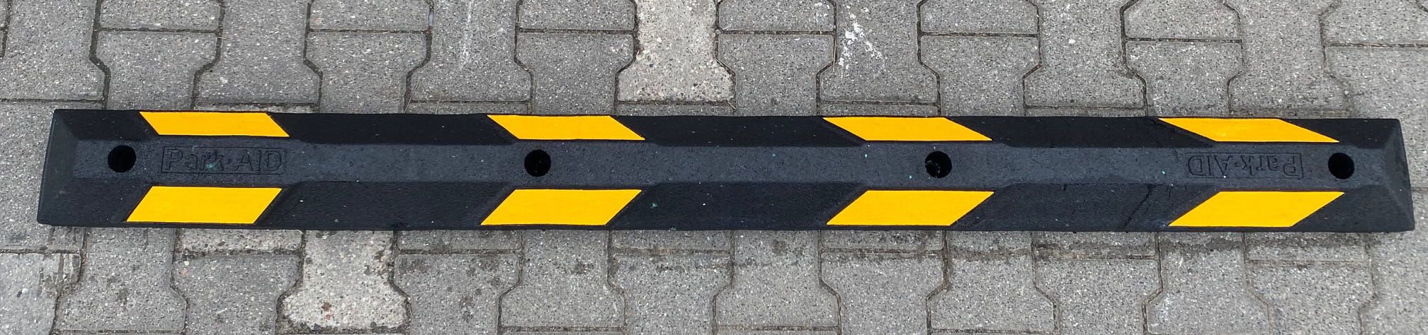 Rubber parking stopper black, with yellow tape